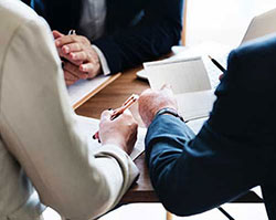 close shot of people looking over documents