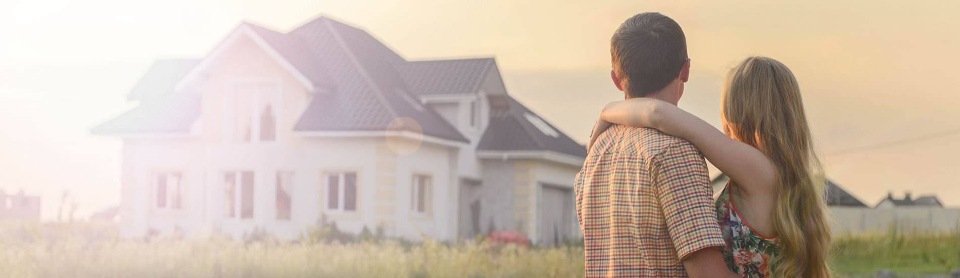 couple looking at house in the distance