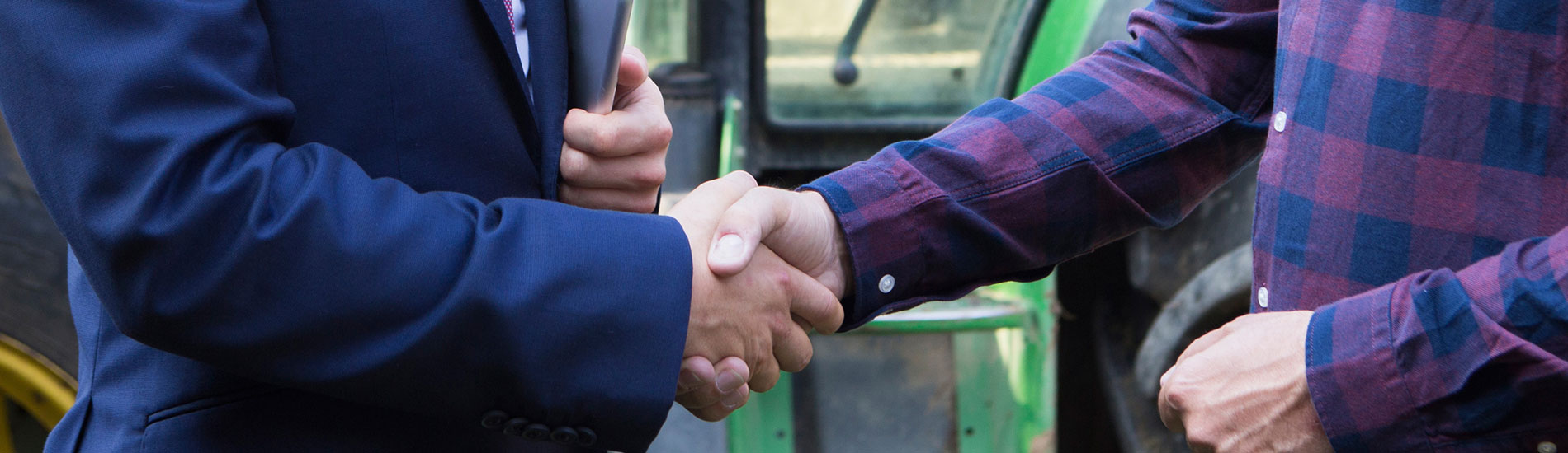 close-up of two men shaking hands