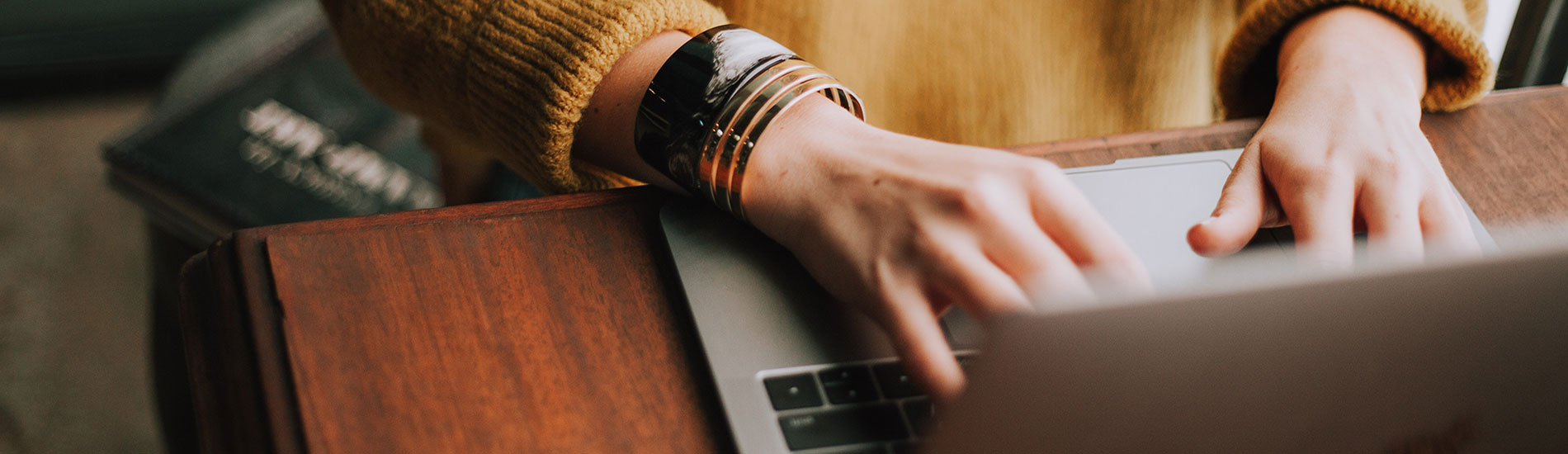 woman typing on laptop