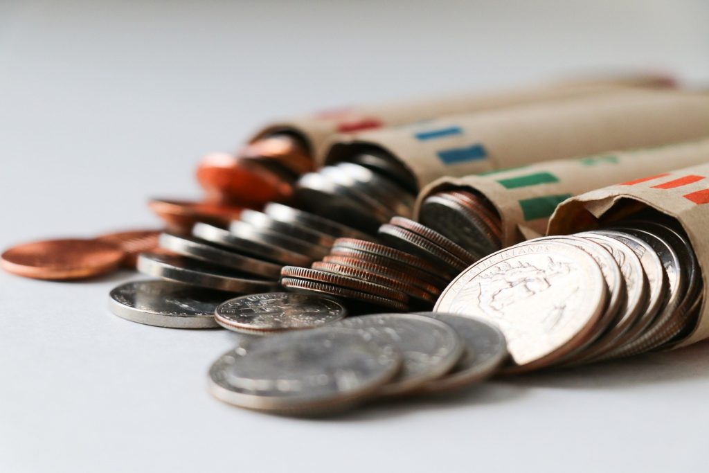 rolled coins with open tops organized in rows